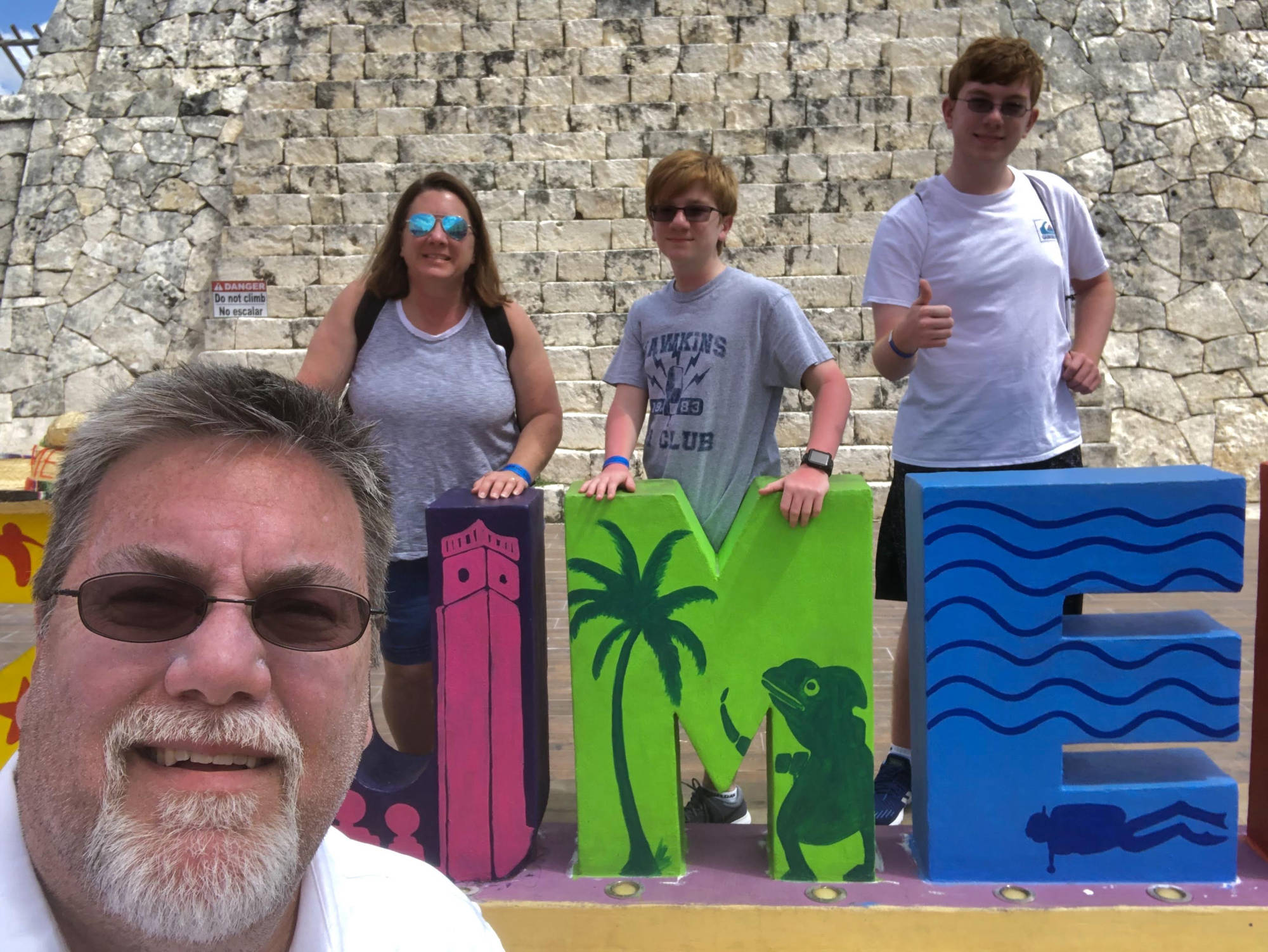 A Photo of David Brodosi and his family posing for a photo in Cozumel Mexico