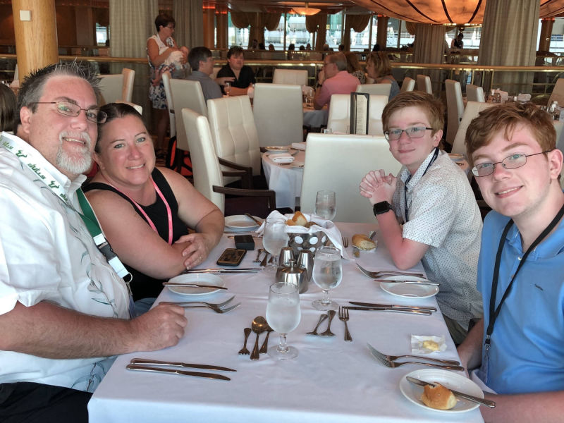 A Photo of David Brodosi and his family at dinner on a cruise ship