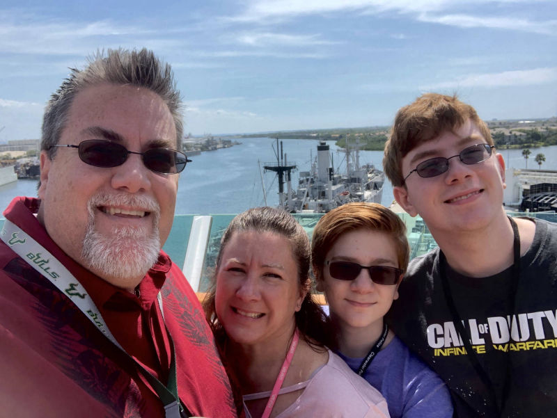 A Photo of David Brodosi and his family on top of the boat